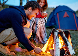 Young couple camping outdoors