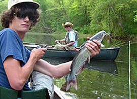 Young man and his father fishing on an arkansas river